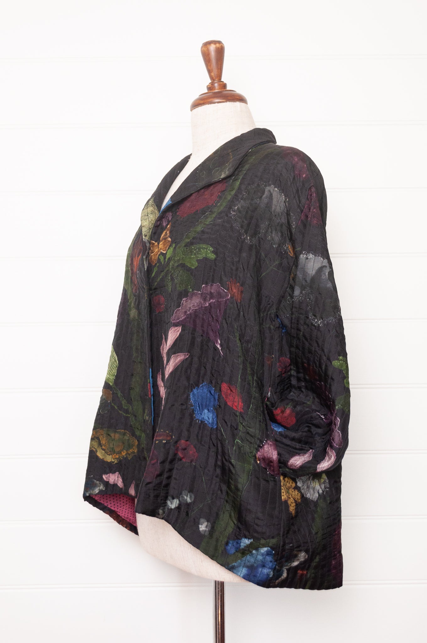 Yavi quilted silk jacket in Vine garden print on ink black, pink block print silk lining.