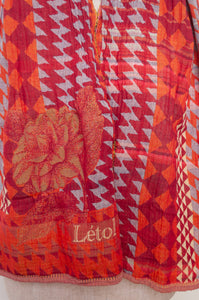 Letol Casimir jacquard weave scarf made in France circus orange and tan houndstooth.