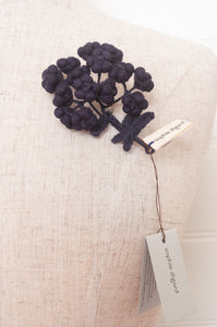 Classic Sophie Digard wool embroidered flower brooch Alpine in dark aubergine.