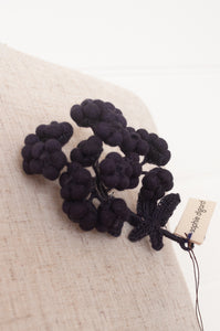 Classic Sophie Digard wool embroidered flower brooch Alpine in dark aubergine.