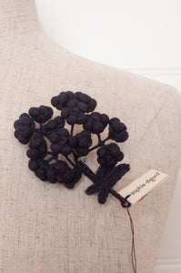 Classic Sophie Digard wool embroidered flower brooch Alpine in dark aubergine.