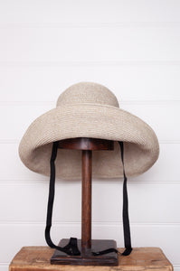 PCNQ made in Japan Leonie foldable paper hat in light grey with black ribbon.