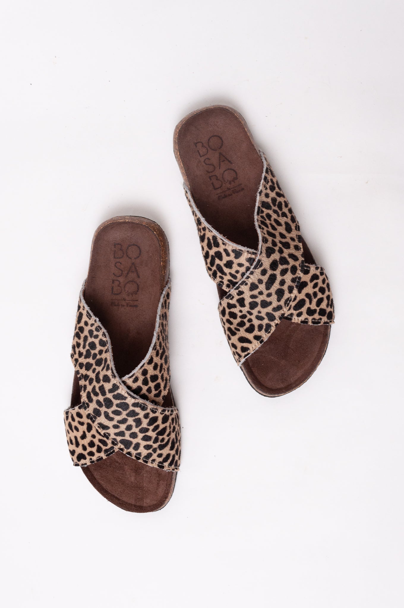 Bosasbo handmade in France cross over slides with molded cork footbed and animal print pony (cowhide) upper.