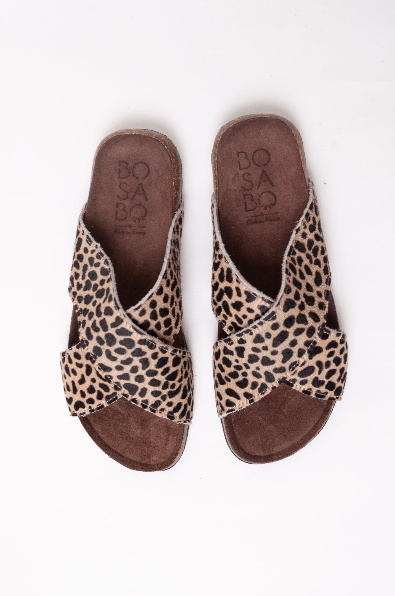 Bosasbo handmade in France cross over slides with molded cork footbed and animal print pony (cowhide) upper.