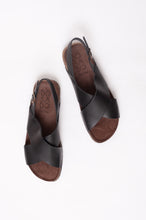 Load image into Gallery viewer, Bosasbo handmade in France cross over slides with molded cork footbed and black calf leather upper with strap and bronze buckle.