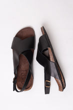 Load image into Gallery viewer, Bosasbo handmade in France cross over slides with molded cork footbed and black calf leather upper with strap and bronze buckle.