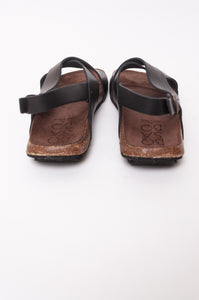 Bosasbo handmade in France cross over slides with molded cork footbed and black calf leather upper with strap and bronze buckle.