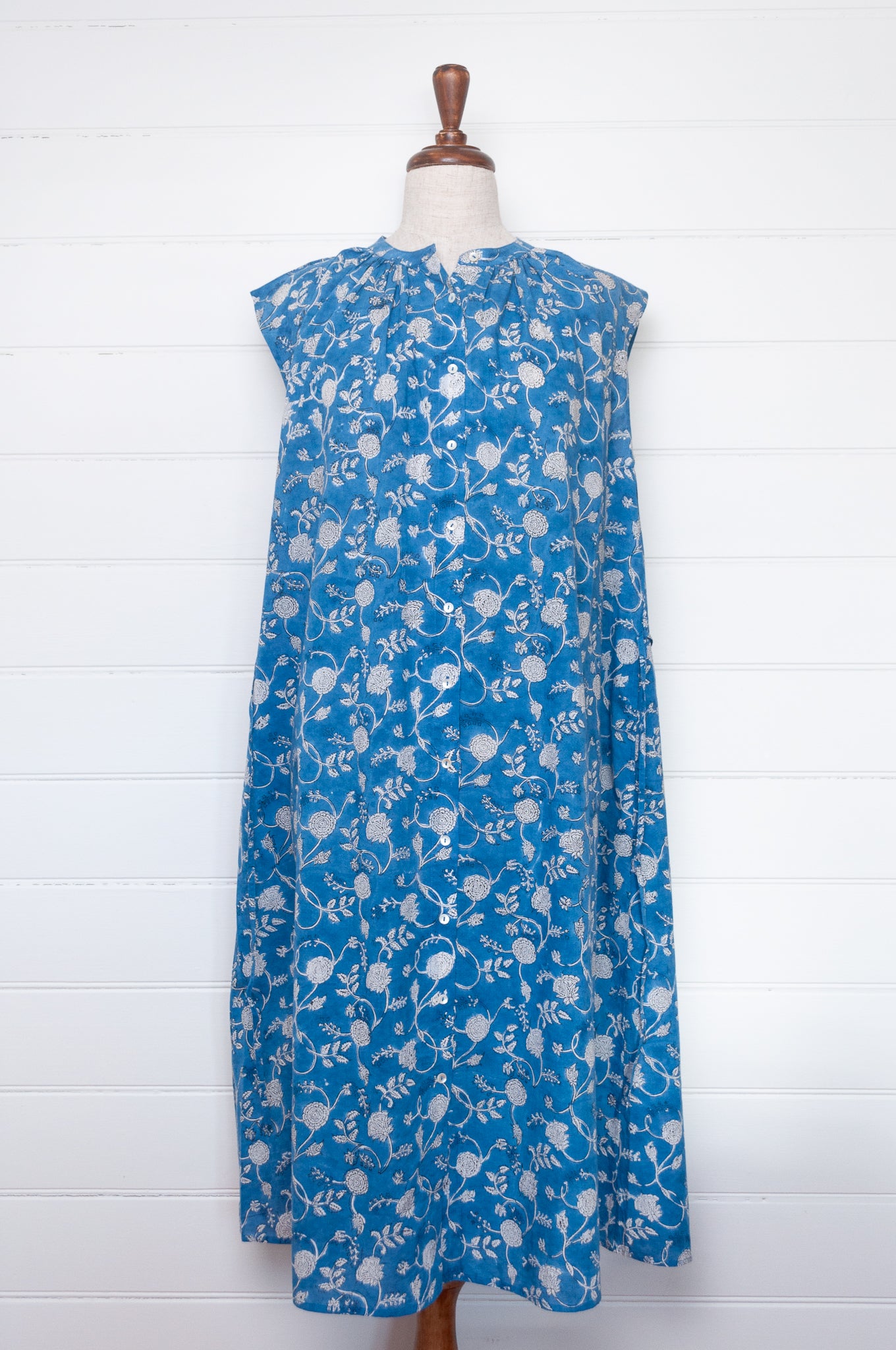 Juniper Hearth Zoe blockprint floral sleeveless cotton dress, buttonup with waist tie, in blue and white.