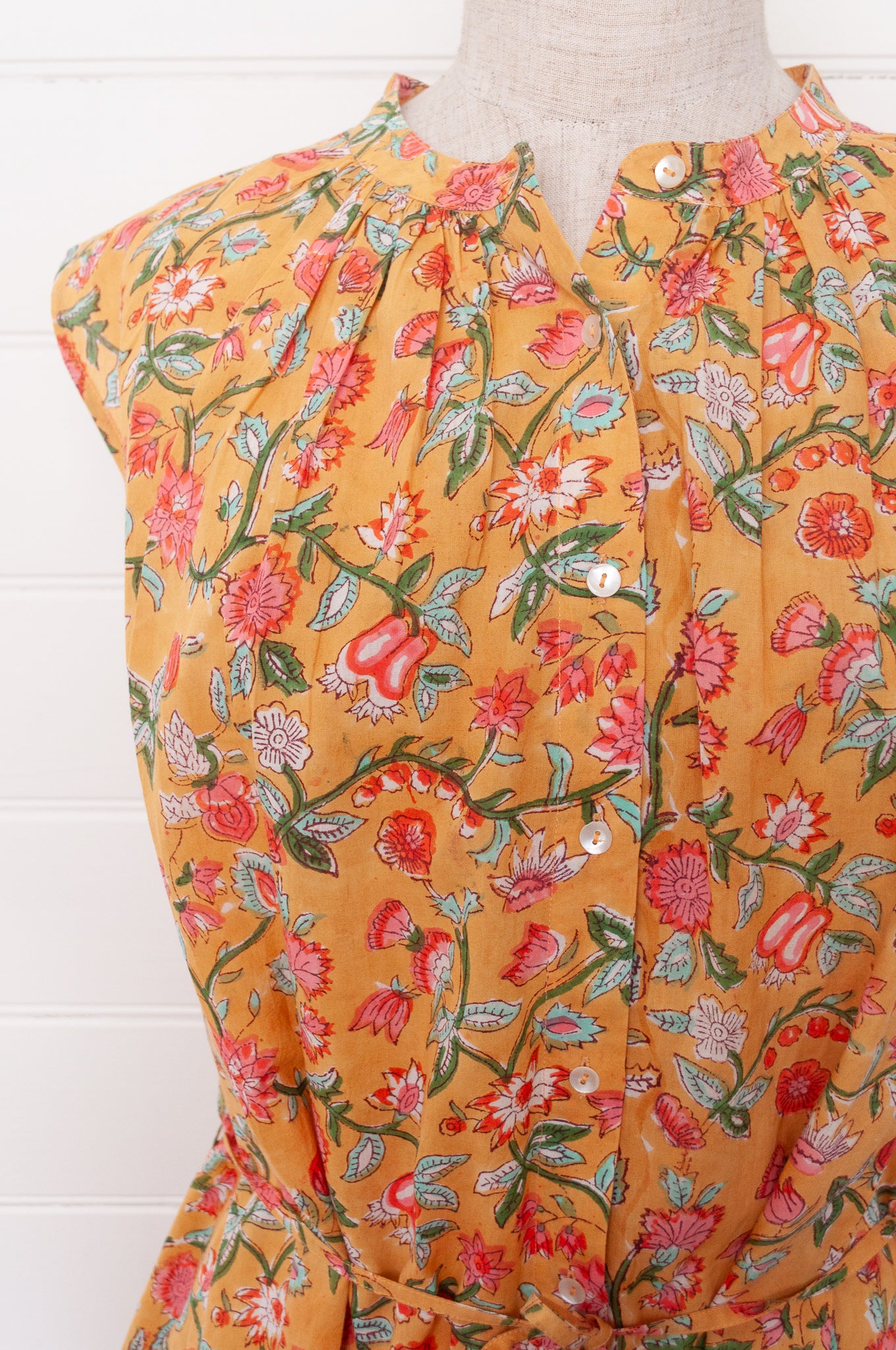 Juniper Hearth Zoe blockprint floral sleeveless cotton dress, buttonup with waist tie, in mustard yellow.