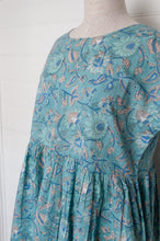 Load image into Gallery viewer, Juniper Hearth blockprint cotton dress with gathered skirt and pockets, in celadon aqua and blue floral.