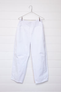 Valia white cotton denim raw horseshoe pant.