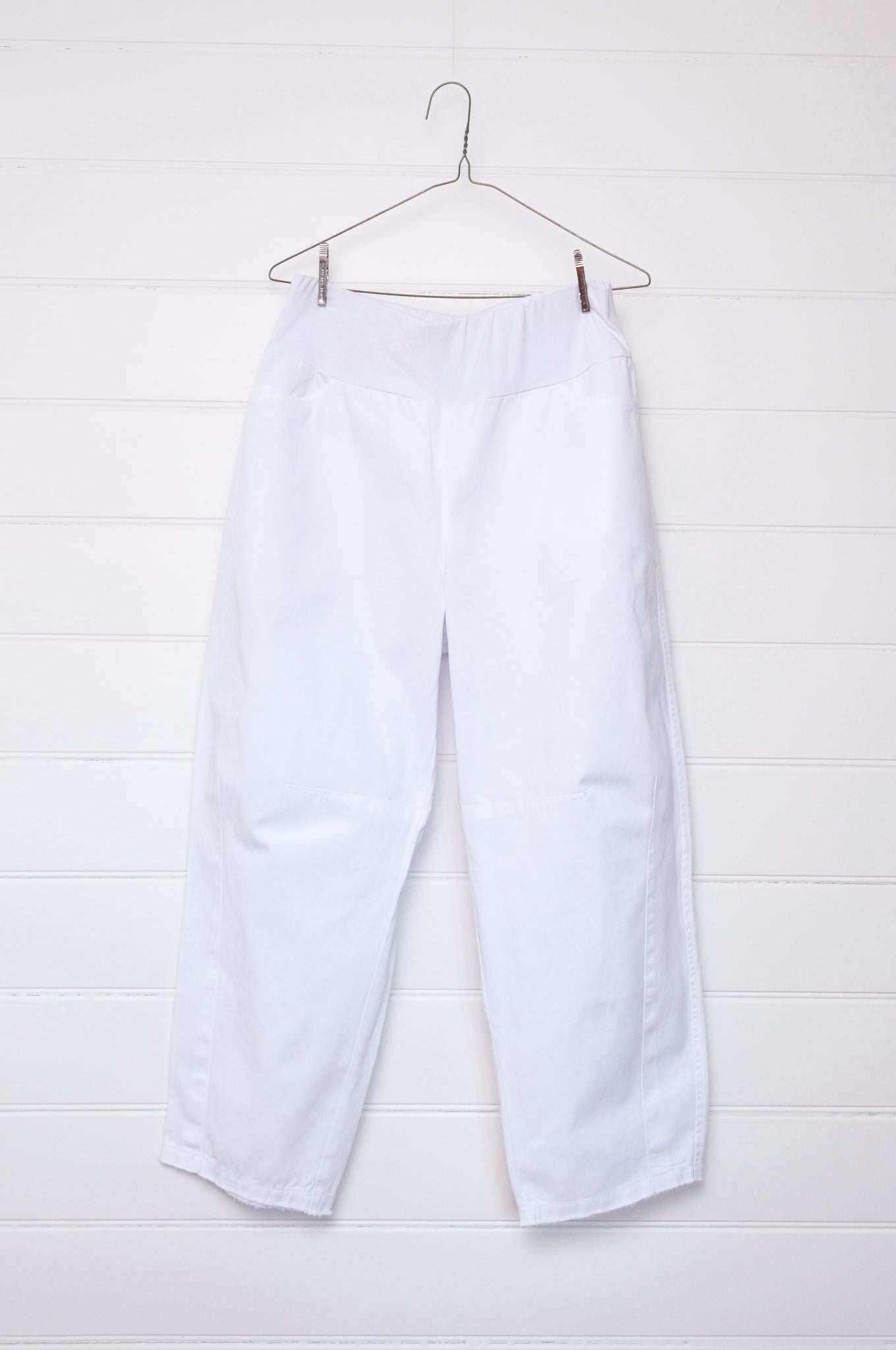 Valia white cotton denim raw horseshoe pant.