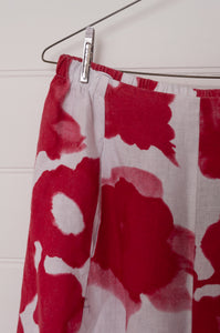 Banana Blue abstract floral print red on white linent pants.