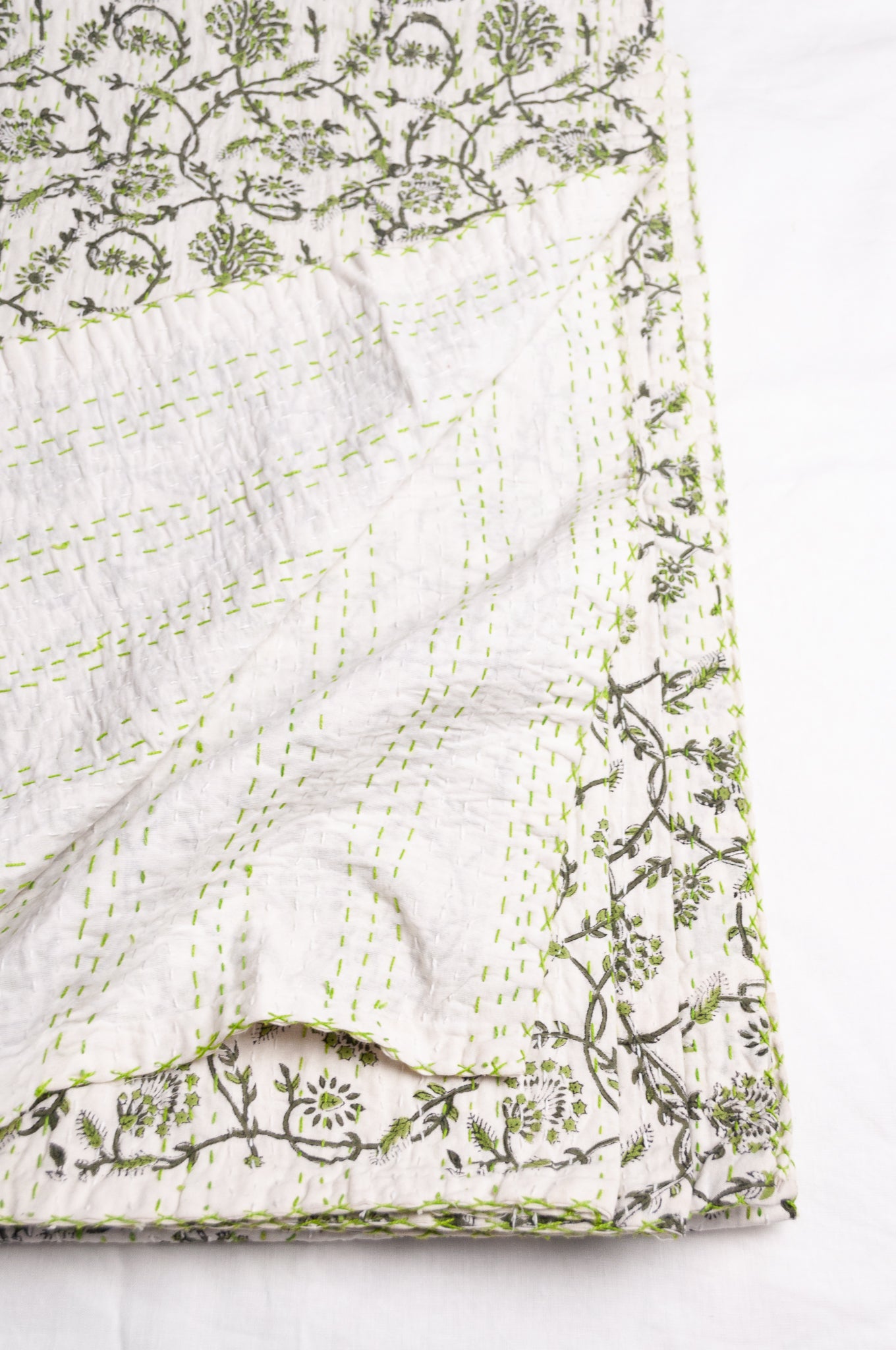 Hand stitched block print pure cotton kantha quilt sage green floral and vine on white.