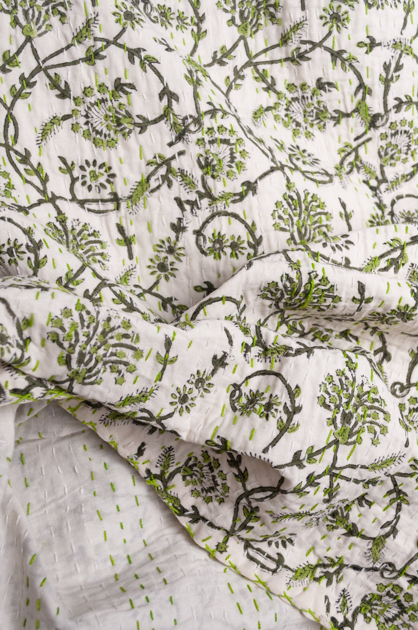 Hand stitched block print pure cotton kantha quilt sage green floral and vine on white.