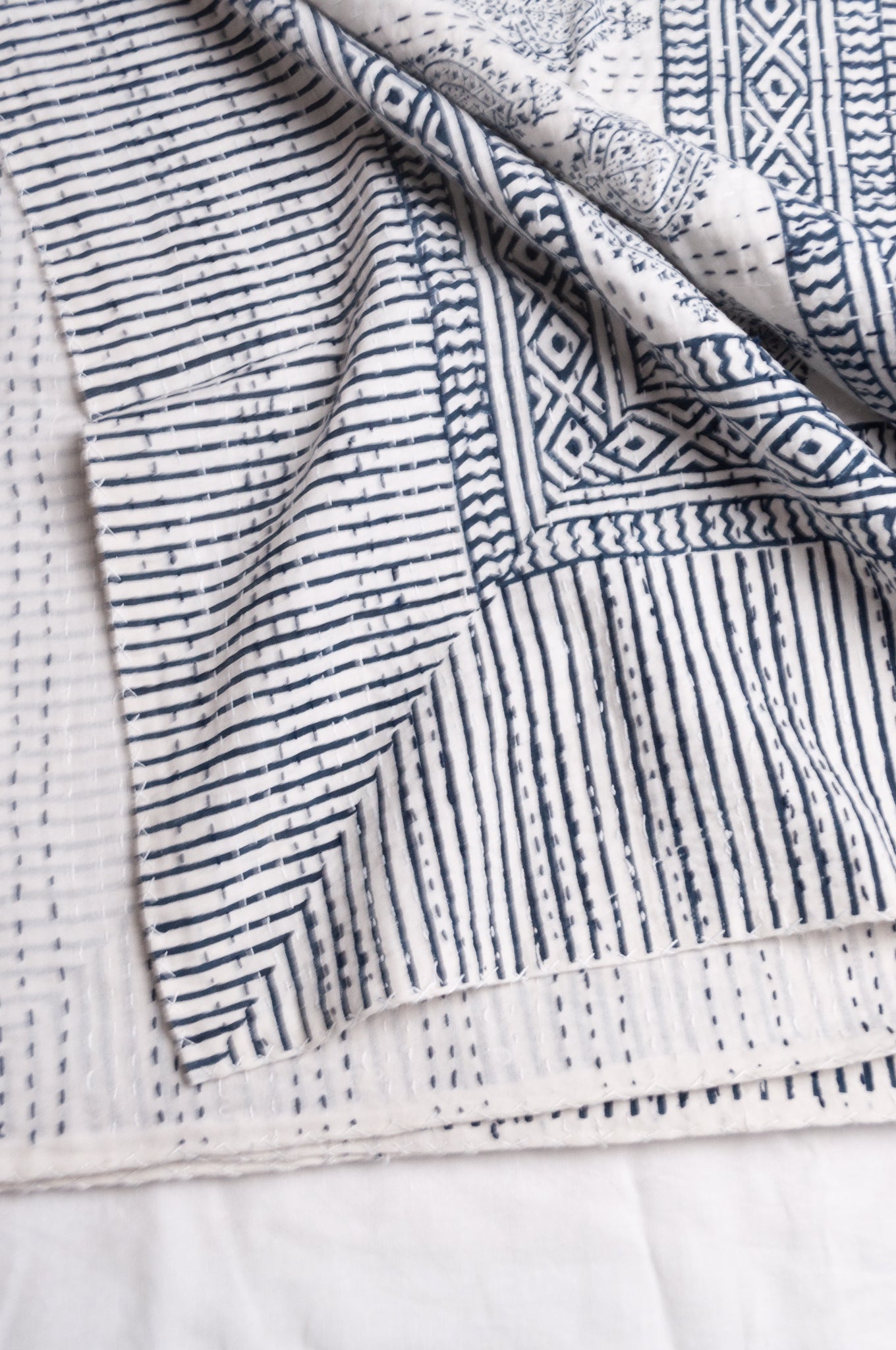Blue and white mogul print cotton kantha quilt.