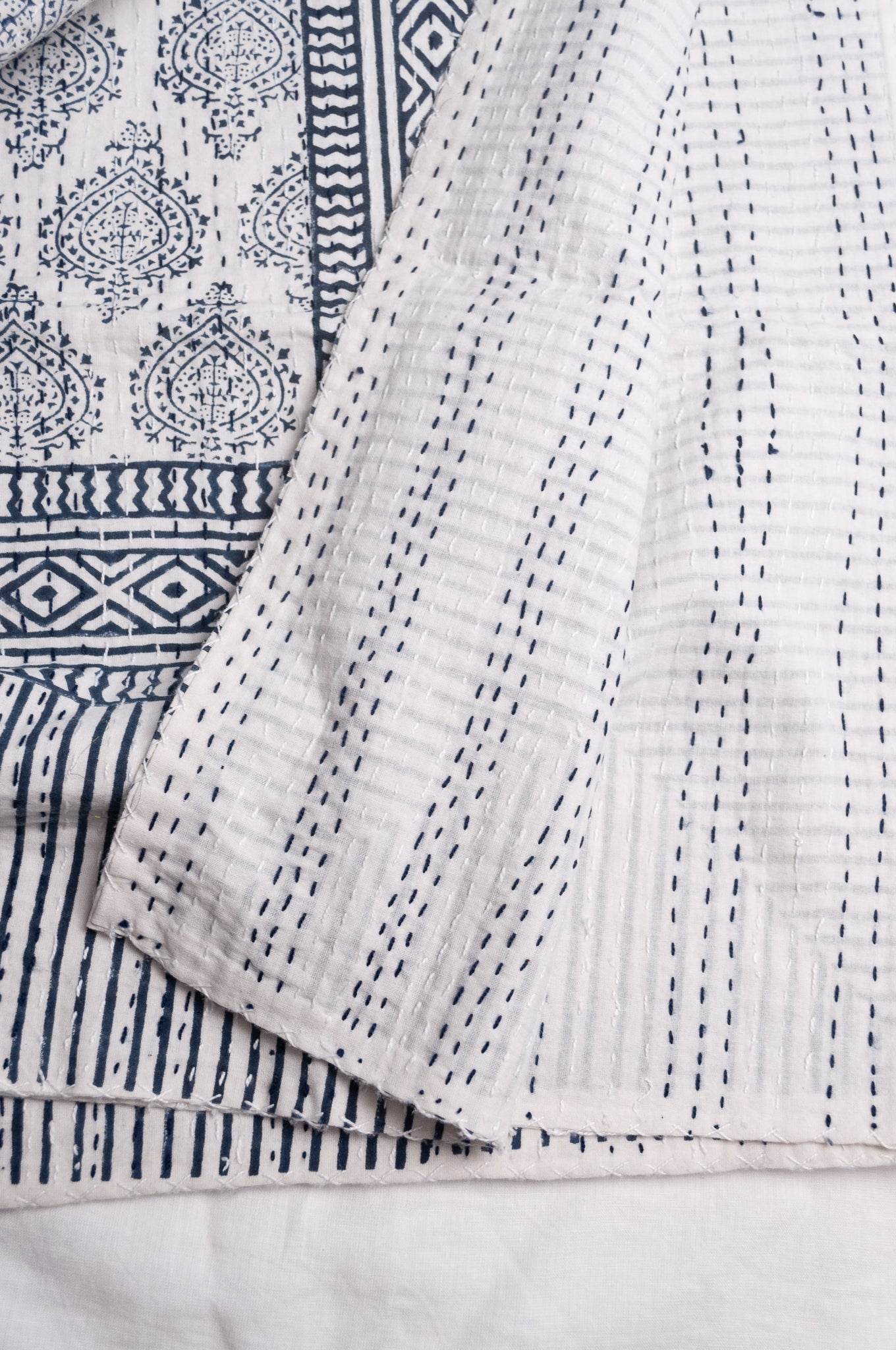 Blue and white mogul print cotton kantha quilt.