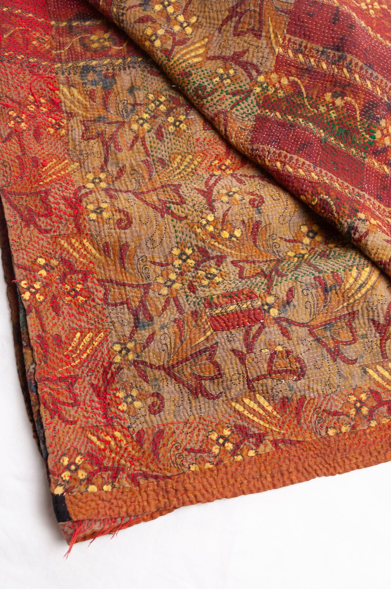 Bagru overdye blockprint vintage kantha quilt in rust red and denim blue on mustard and olive.