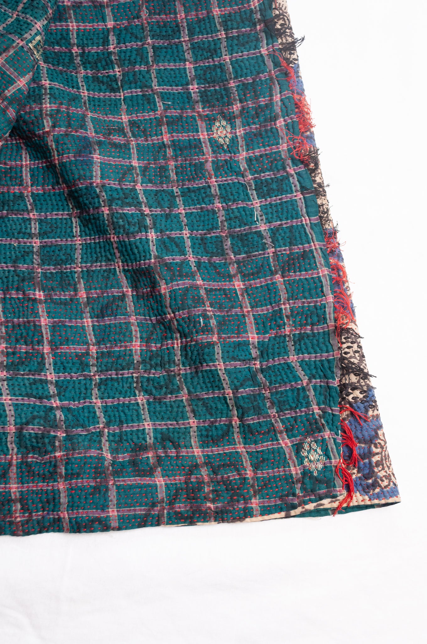 Bagru over print vintage blockprint kantha quilt, floral on denim blue with red embroidery and green plaid reverse.