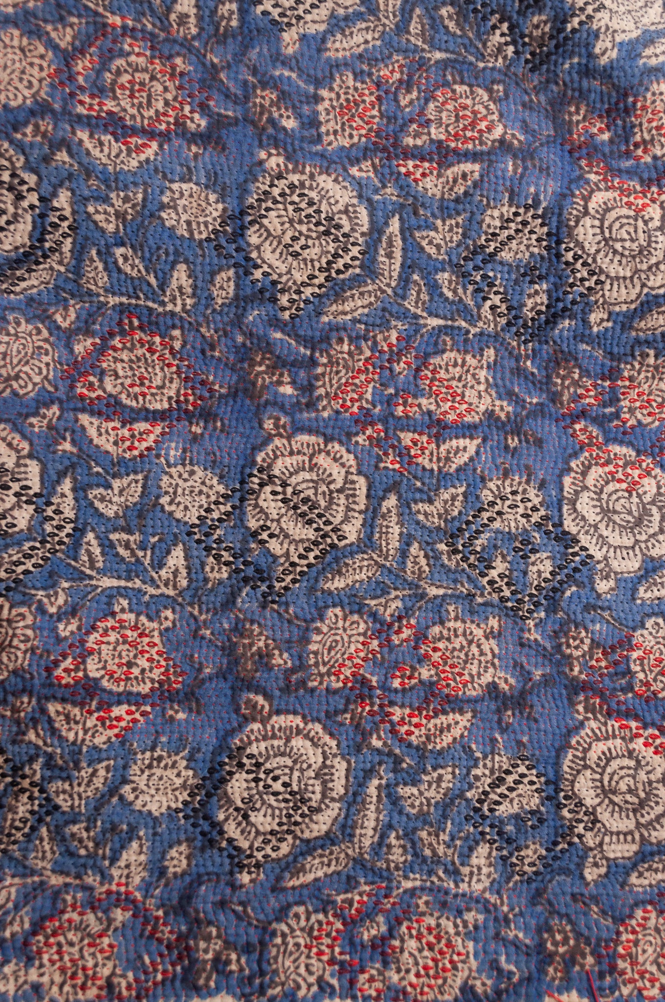 Bagru over print vintage blockprint kantha quilt, floral on denim blue with red embroidery and green plaid reverse.