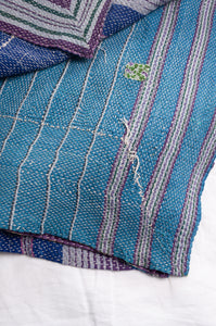 Multi colour striped vintage kantha quilt.