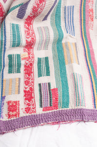 Multi colour patched white vintage kantha quilt.