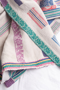 Multi colour patched white vintage kantha quilt.