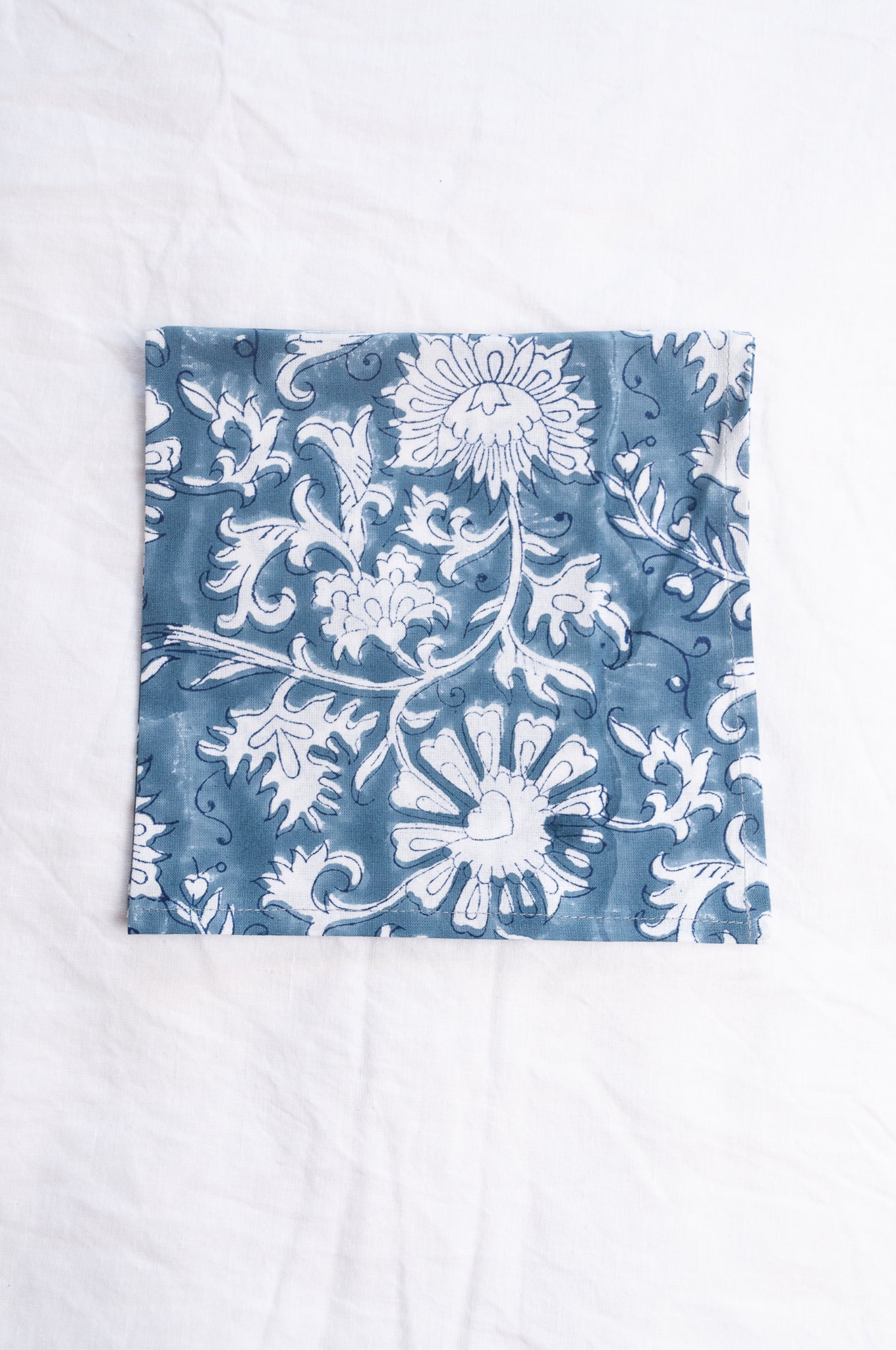 Juniper Hearth blockprint cotton napkin in blue and white floral.