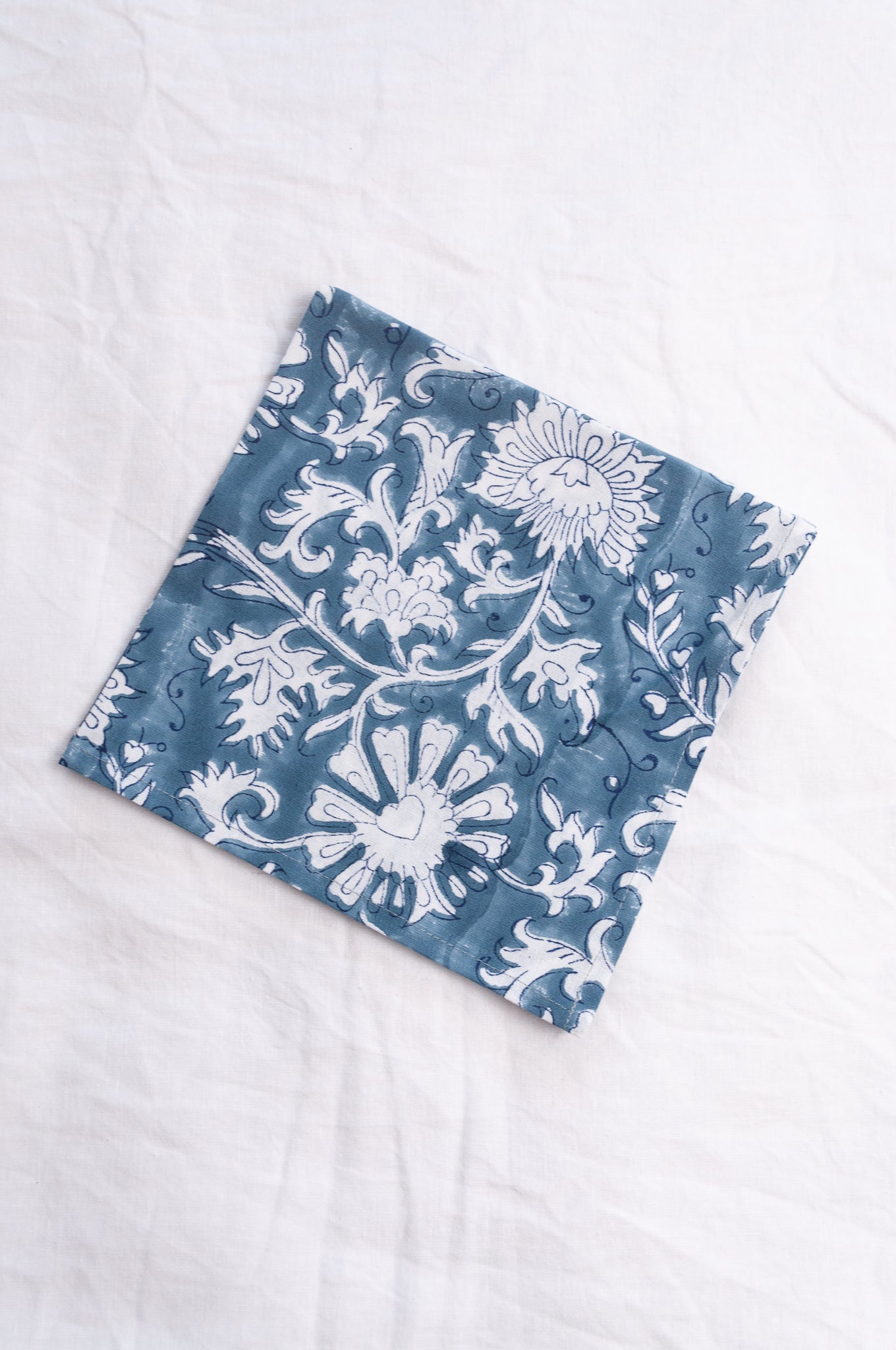 Juniper Hearth blockprint cotton napkin in blue and white floral.