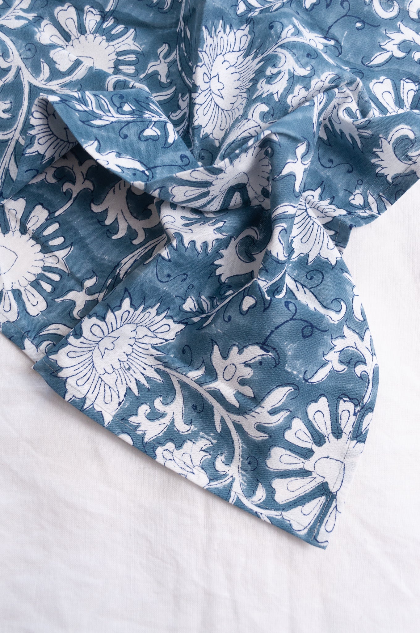 Juniper Hearth blockprint cotton napkin in blue and white floral.
