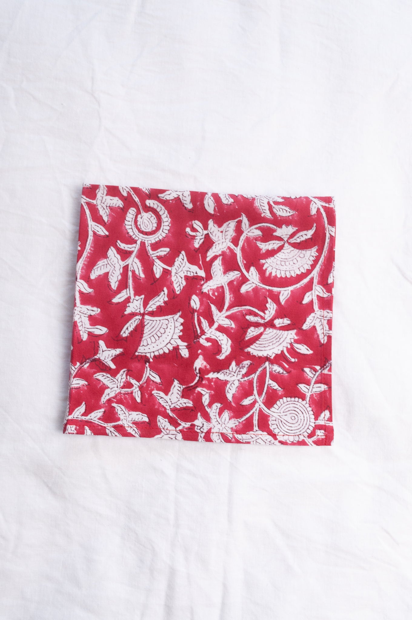 Juniper Hearth blockprint cotton napkin in red and white floral.