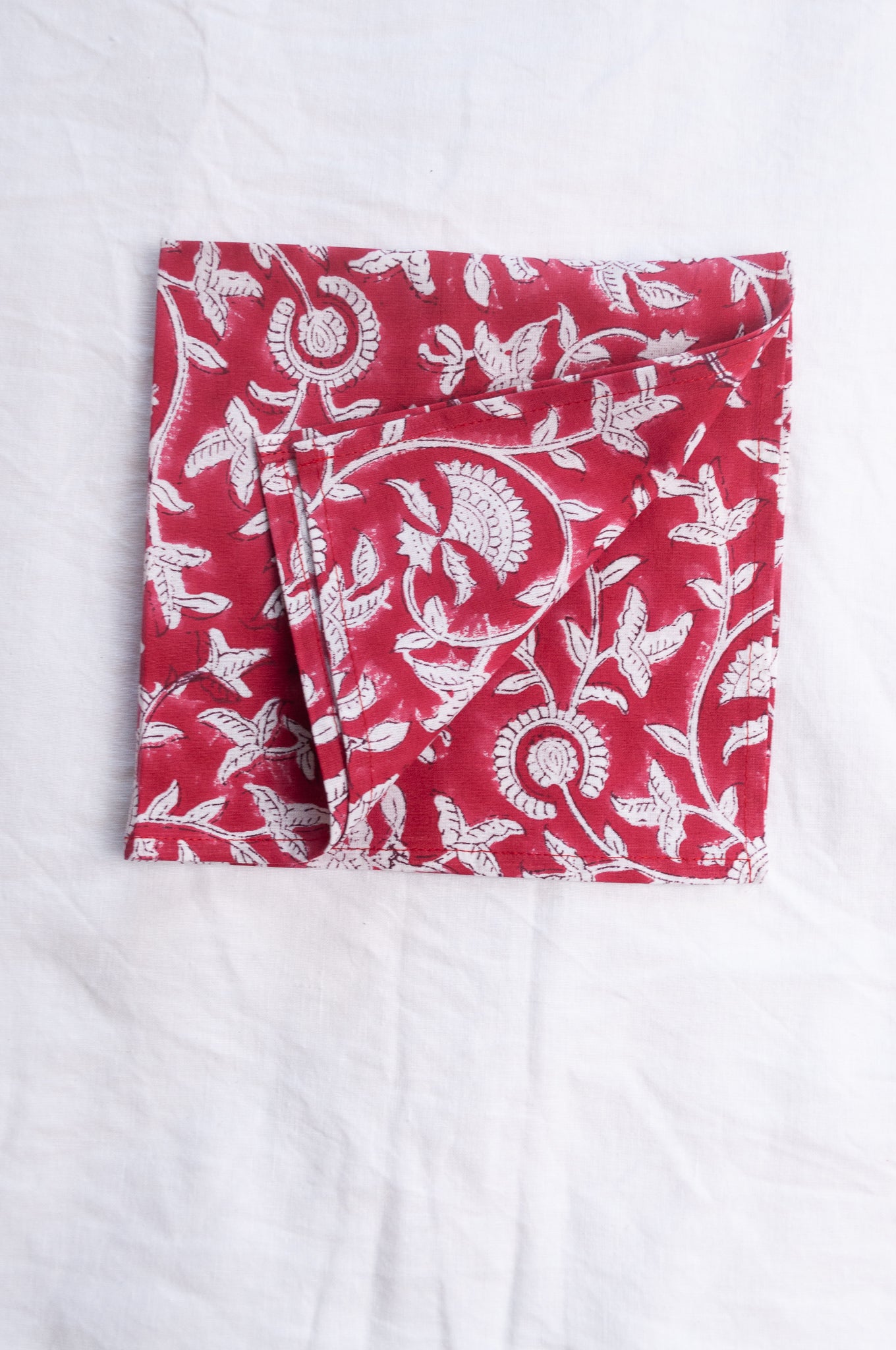 Juniper Hearth blockprint cotton napkin in red and white floral.