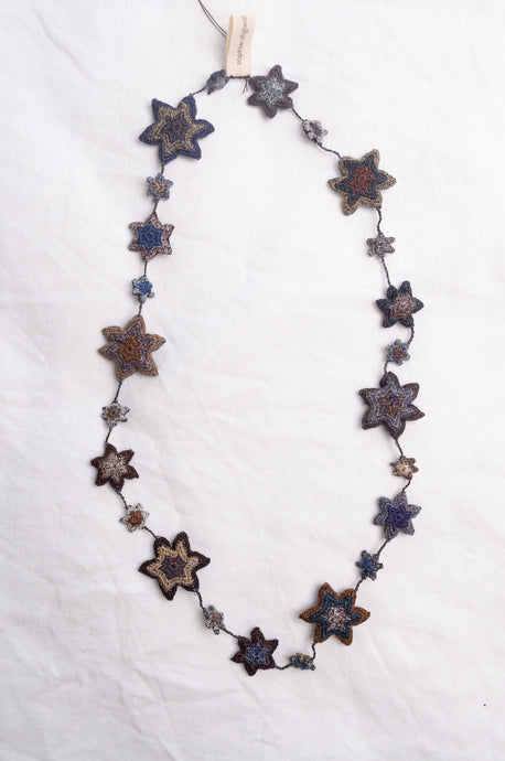 Sophie Digard etoile star crocheted linen necklace in deep shades of navy and browns.