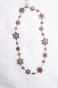 Sophie Digard etoile star crocheted linen necklace in pastel tones.