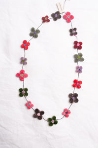 Sophie Digard classic velour flour necklace in bright pinks and greens.