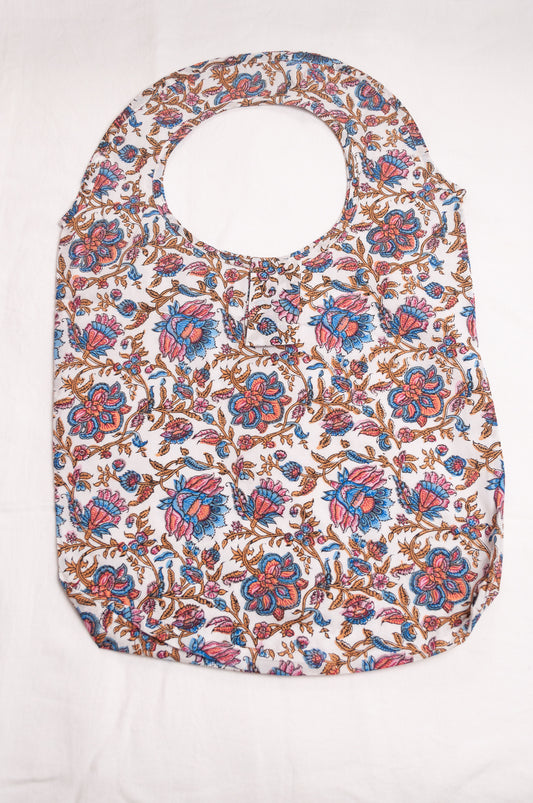 Fabric shopping tote, rollable, in blockprint floral cotton.