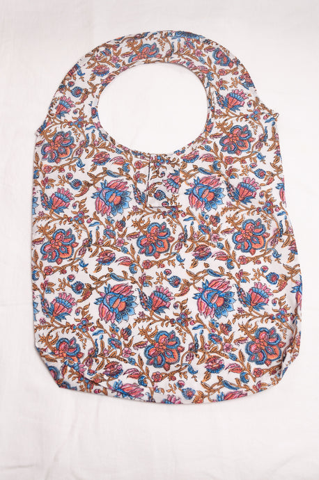 Fabric shopping tote, rollable, in blockprint floral cotton.