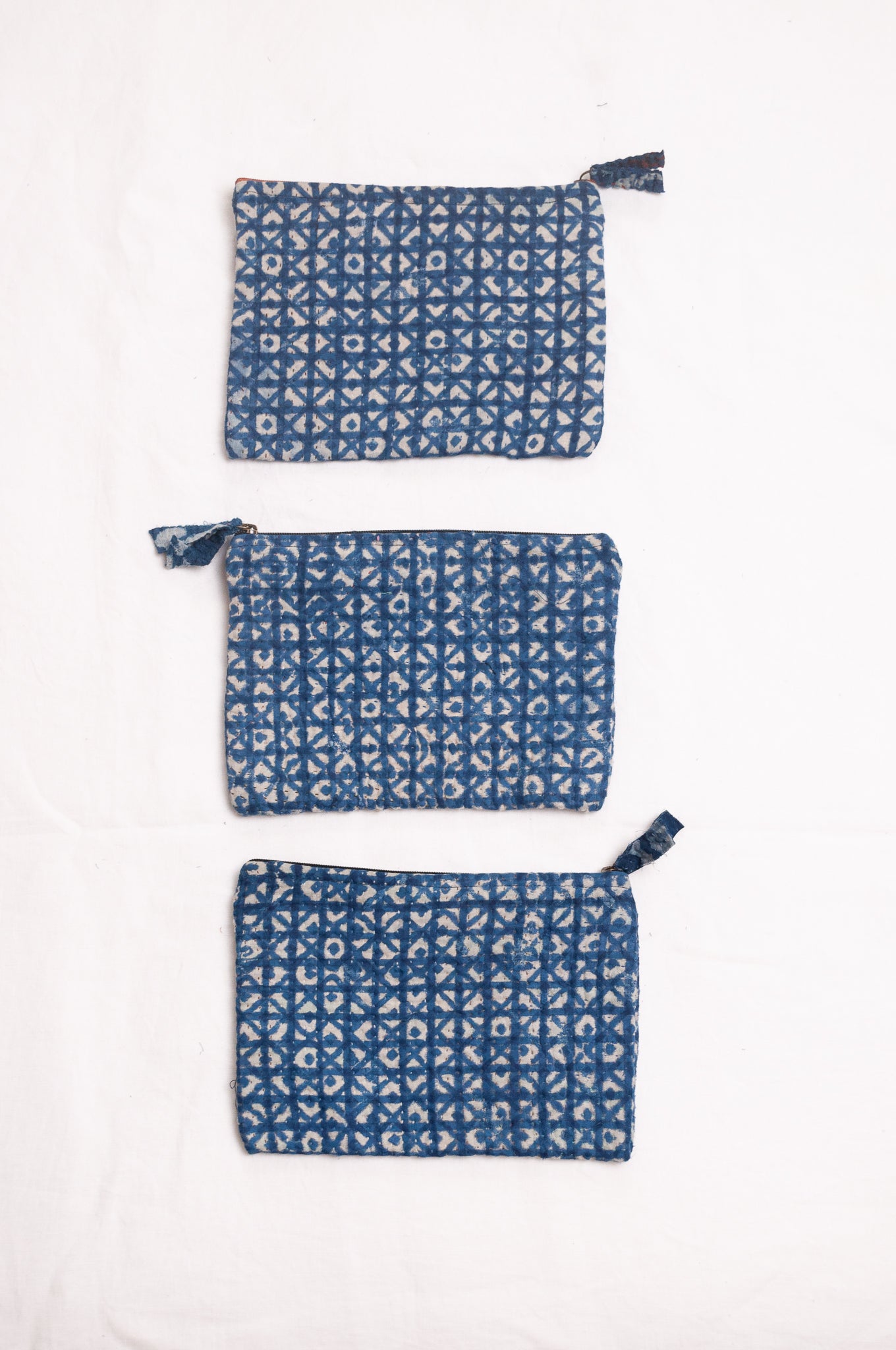 Vintage kantha quilt zippered pouch in overdyed indigo blockprint.