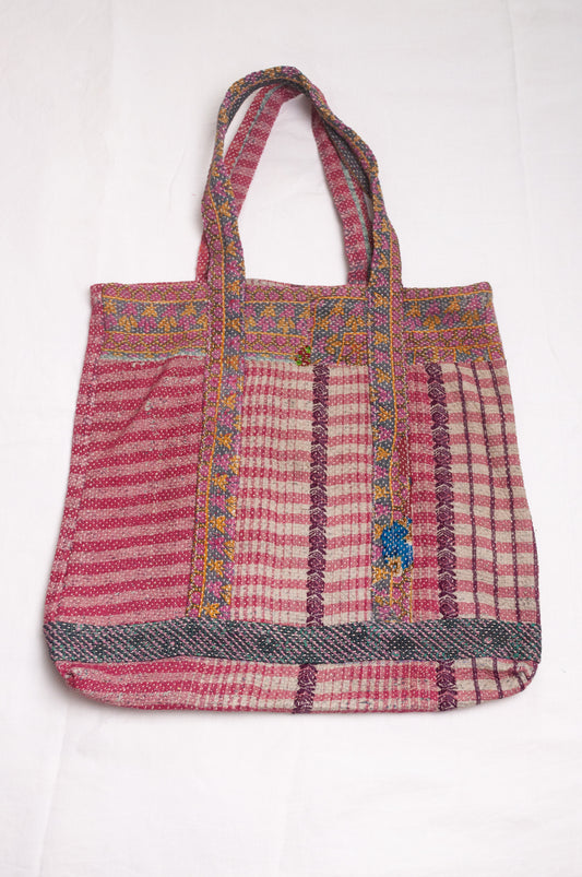 Vintage kantha quilt tote bag in deep rose pink stripe and floral pattern.