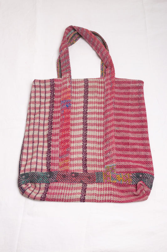 Vintage kantha quilt tote bag in deep rose pink stripe and floral pattern.