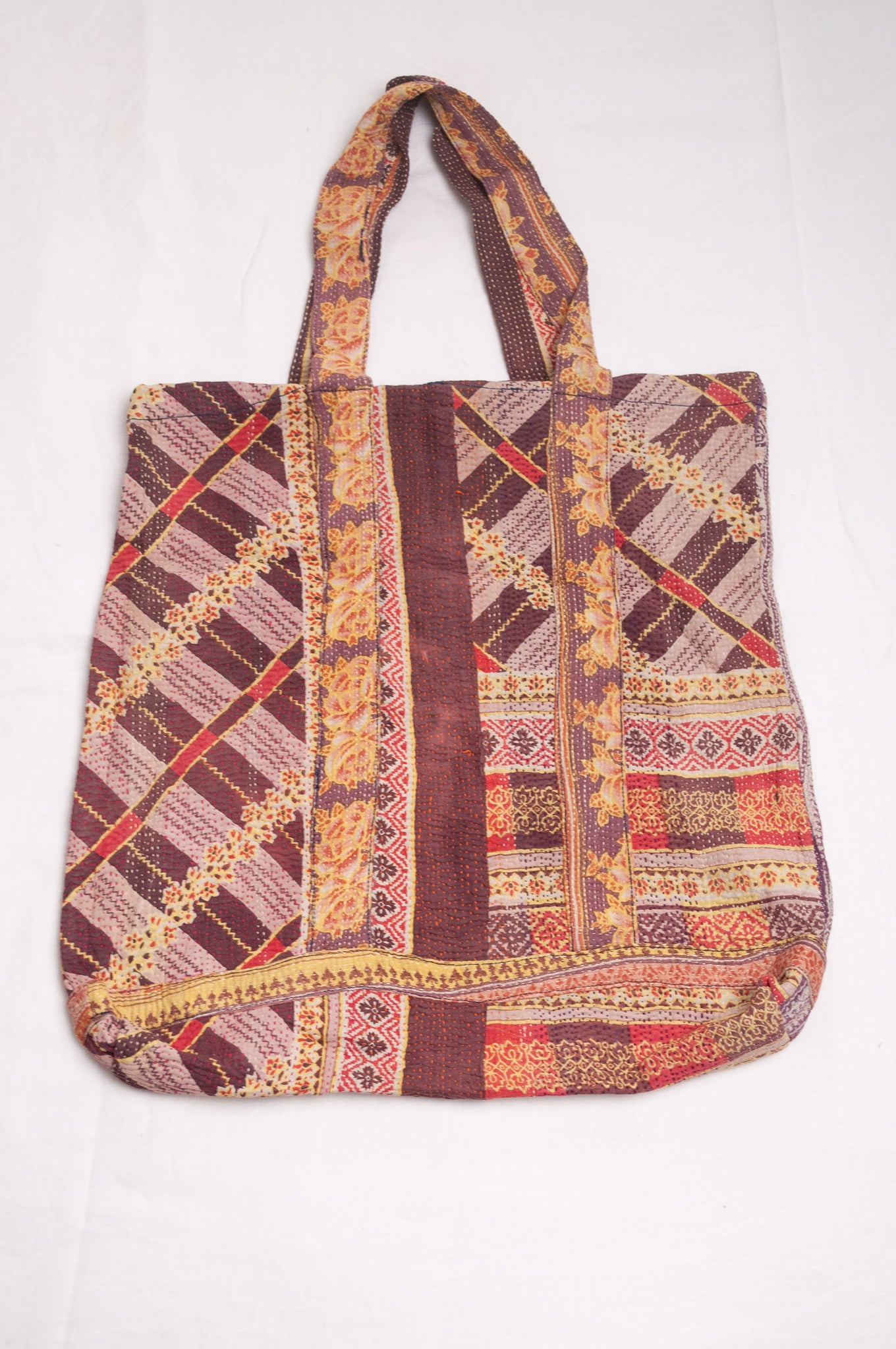 Vintage kantha quilt tote bag in chocolate stripe and floral pattern.