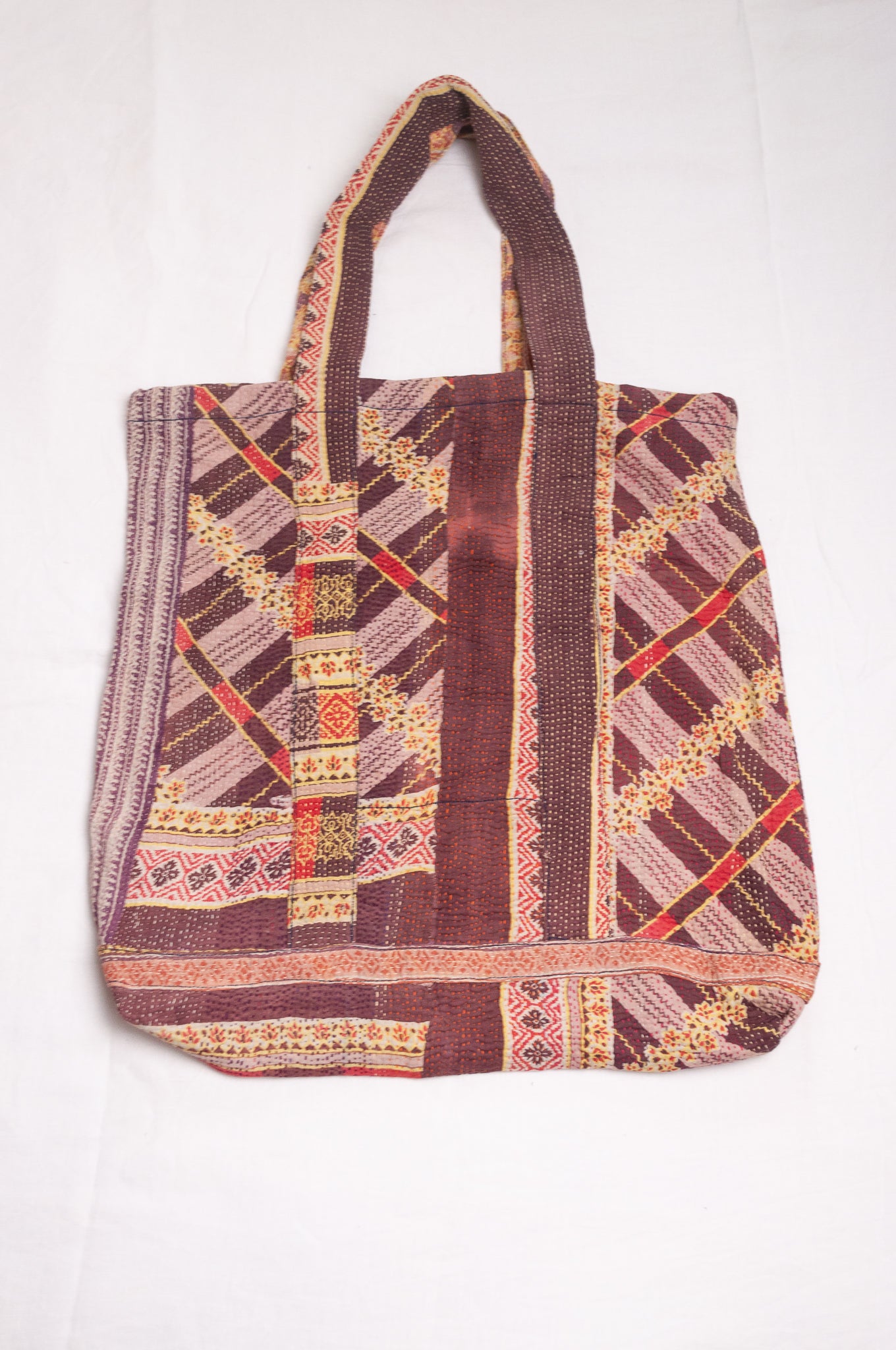 Vintage kantha quilt tote bag in chocolate stripe and floral pattern.