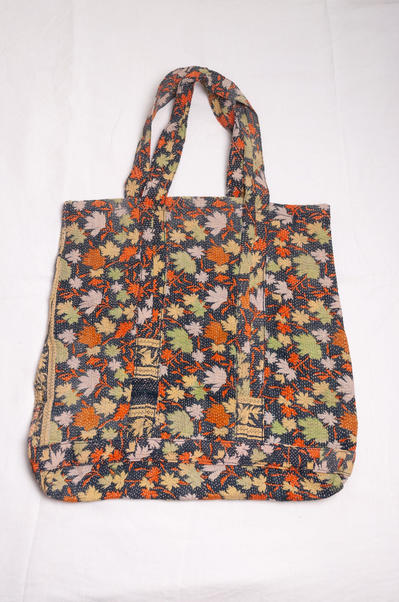 Vintage kantha quilt tote bag in autumn leaves pattern.
