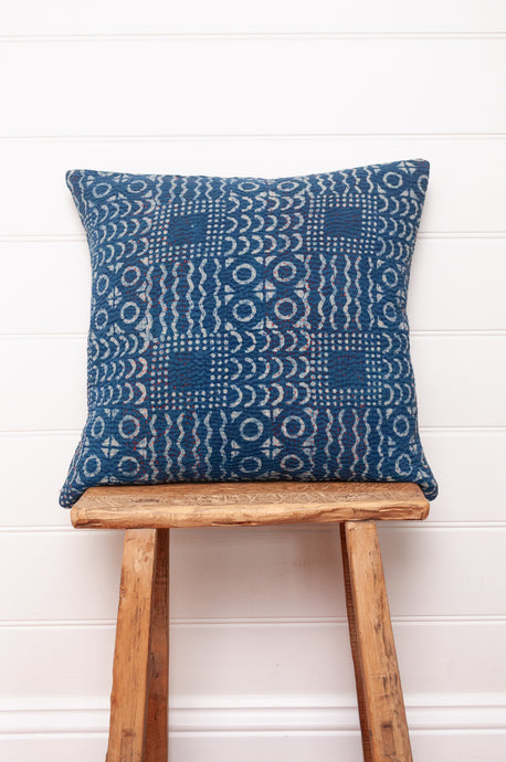 Vintage indigo kantha cushion overdyed with patchwork print.