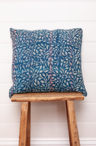 Vintage indigo kantha cushion overdyed with floral print.