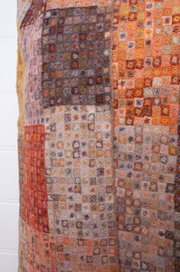 Sophie Digard crochet wool scarf tiny squares forming larger patches of earthy tones.