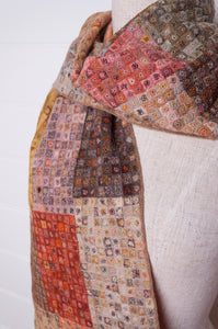 Sophie Digard crochet wool scarf tiny squares forming larger patches of earthy tones.