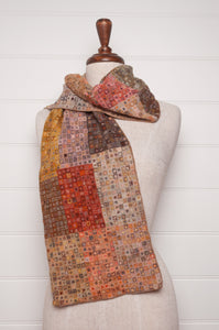 Sophie Digard crochet wool scarf tiny squares forming larger patches of earthy tones.