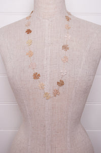 Sophie Digard fine crochet flower necklace in natural tones.