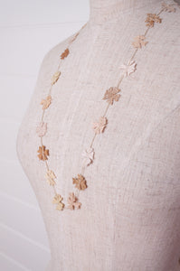 Sophie Digard fine crochet flower necklace in natural tones.